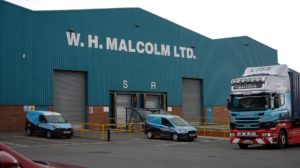 A loading bay in front a of W.H. Malcolm warehouse